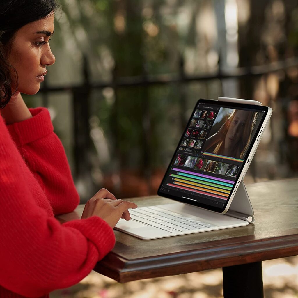 woman with Apple 12.9-inch iPad Pro